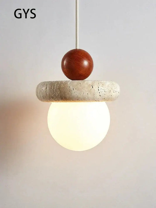 A modern cream stone wood globe pendant light featuring a wooden sphere, concrete ring, and frosted glass for bedroom decor