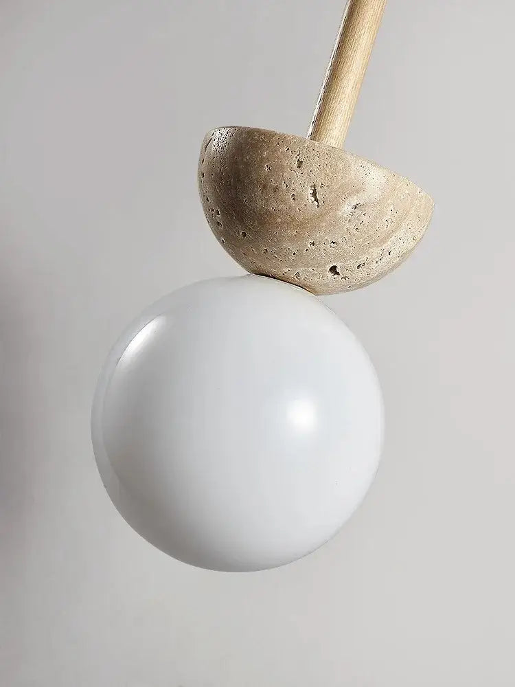 Modern cream style led pendant lamp with a matte white glass globe and beige stone concrete half-dome decorbites cream style