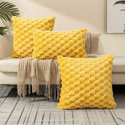 Bright yellow decorative pillow covers with plush raised pom-pom texture for modern living room decor