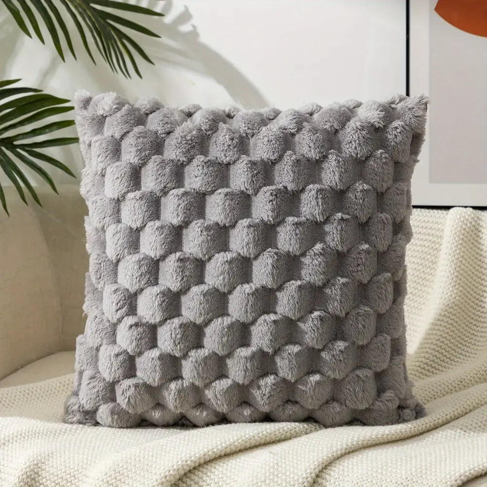 Modern gray plush decorative pillow cover with textured raised pom pom pattern for living room use