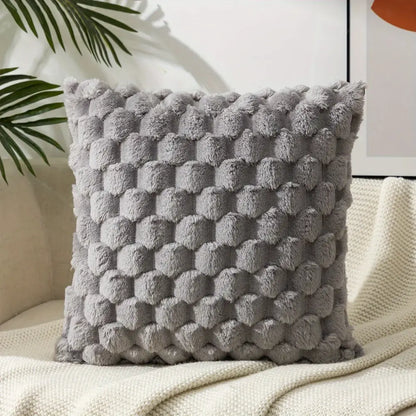 Modern gray plush decorative pillow cover with textured raised pom pom pattern for living room use