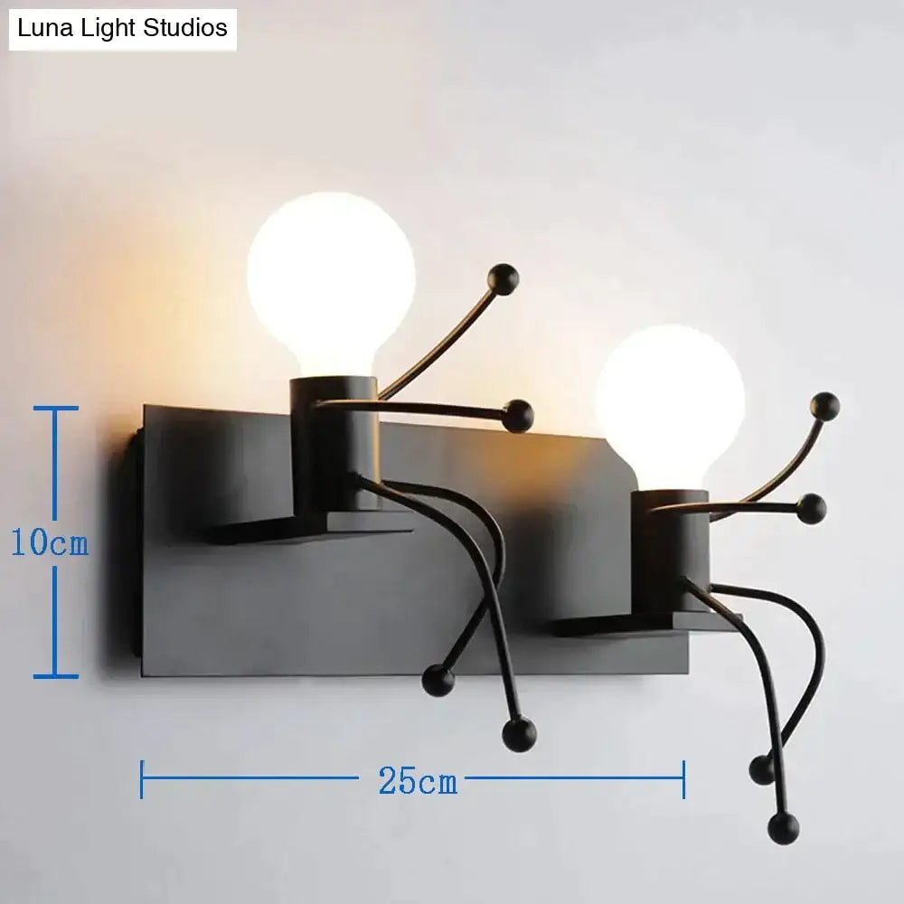 Black metal wall sconce with two exposed bulbs and articulated arms showcasing modern creative minimalism design