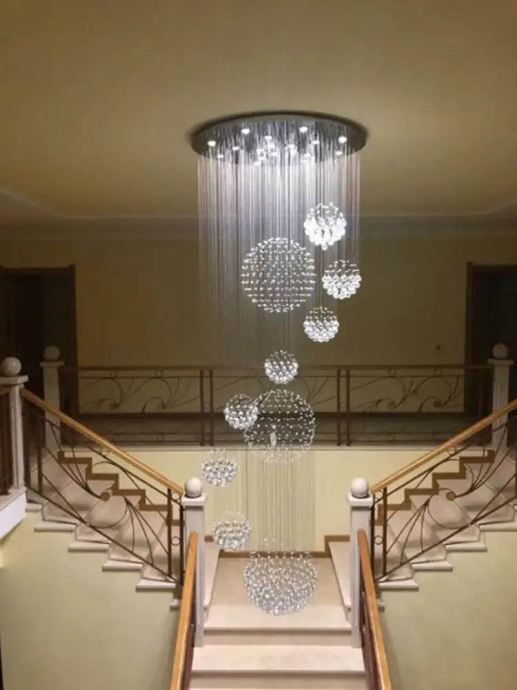 A modern decorbites crystal ball chandelier with cascading spherical clusters for elegant dining room decor