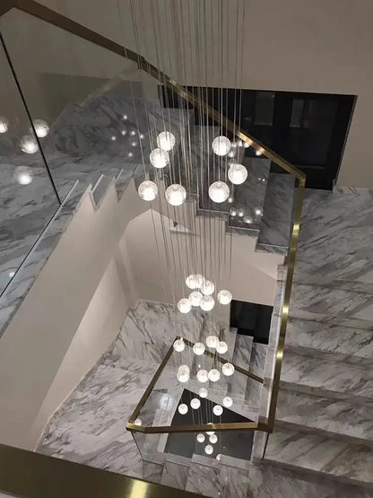 Modern crystal ball led chandelier with spherical glass and cascading design suspended by metallic wires for living room decorbites decor