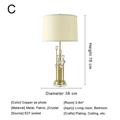 Modern decorbites crystal bedside lamp with gold-toned base, clear crystal accents and cream fabric shade for bedroom decor