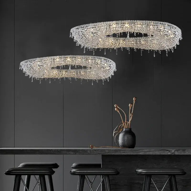 Two elegant circular crystal bird nest chandeliers with cascading droplets for modern dining room lighting
