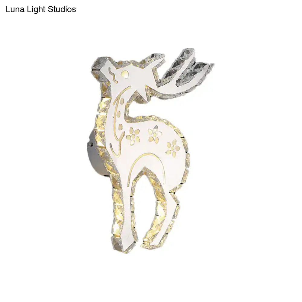 A sleek modern white and gold crystal block elk wall sconce with white led and warm white bedroom lighting