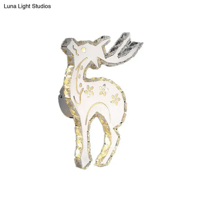 A sleek modern white and gold crystal block elk wall sconce with white led and warm white bedroom lighting