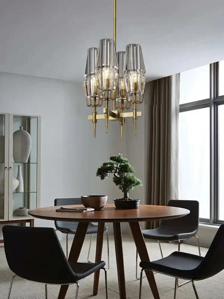 Modern crystal brass glass pendant light featuring brass and clear glass with multiple cylindrical shades for dining room decorbites crystal brass chandelier