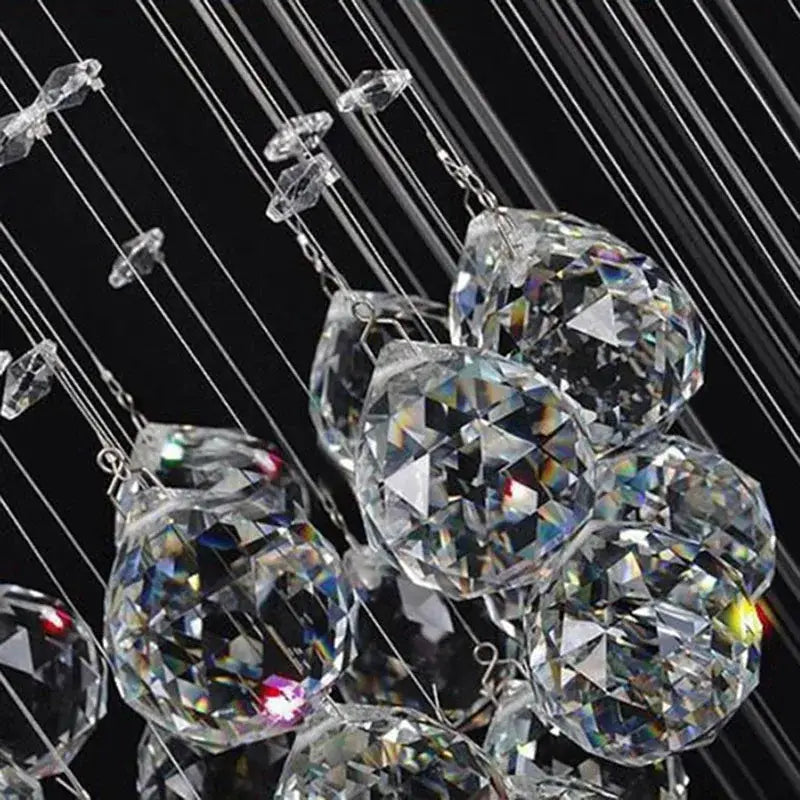 Modern crystal chandelier with clear faceted glass spheres hanging on thin wires by decorbites crystal chandelier