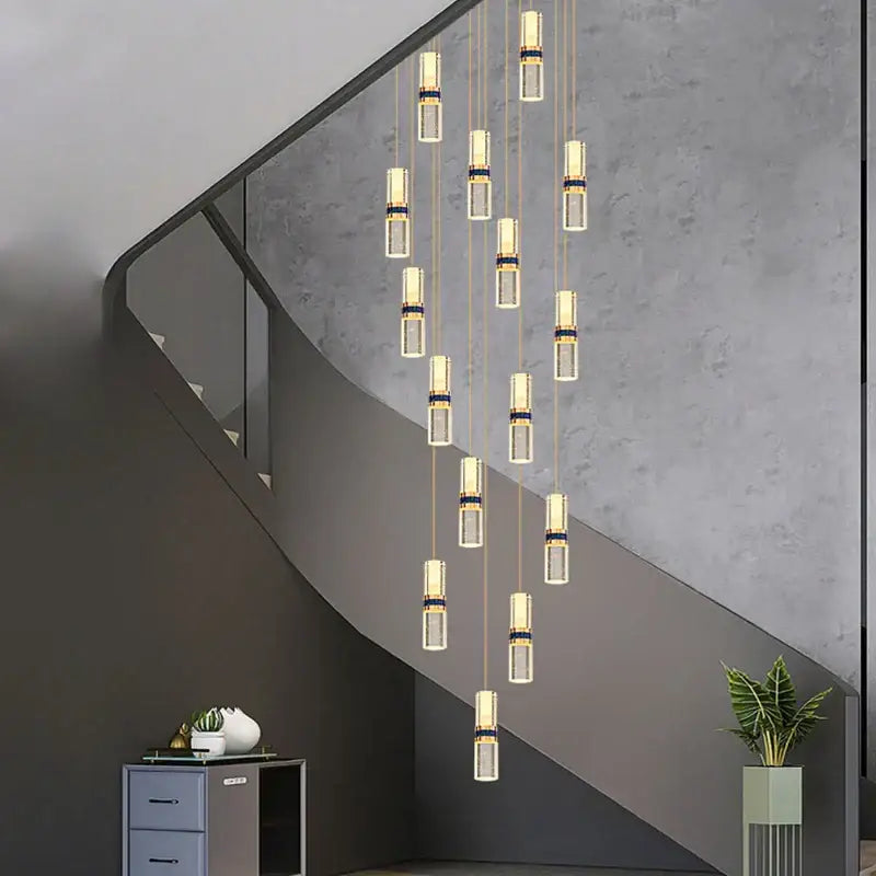 Modern crystal columnar chandelier stair lamp featuring clear glass cylinders and gold-toned metallic accents decorbites crystal columnar