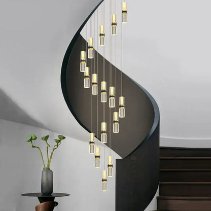 Modern spiral staircase with sleek black metal railings complemented by a crystal columnar chandelier stairwell light