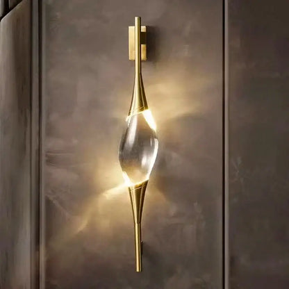 Modern crystal copper wall sconce with gold tone and clear teardrop crystal centerpiece for dining room decorbites crystal copper