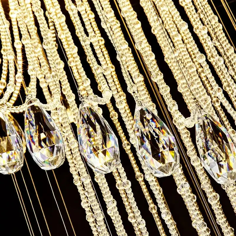 Modern crystal double spiral staircase chandelier featuring crystal teardrop pendants and clear glass beads