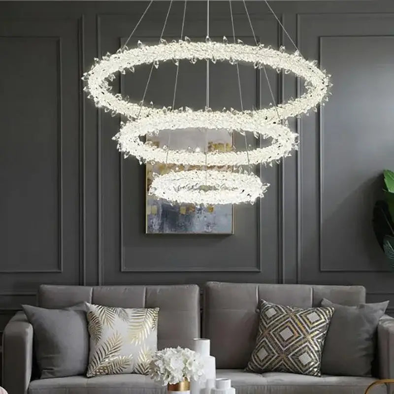A modern crystal flower led chandelier with cascading crystals and a sleek metallic frame for living room decorbites decor