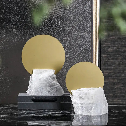 Modern crystal geometric metal sculpture bookends with translucent quartz bases and polished gold tops for living room decorbites