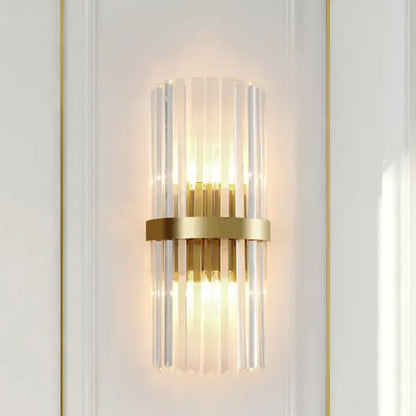 Modern crystal gold led wall sconce featuring gold-toned vertical glass rods and a central brass ring by decorbites crystal gold
