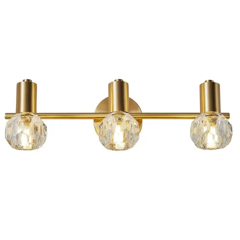 Gold-toned modern crystal gold wall lamp with three faceted globe shades for bedroom decorbites crystal gold wall lighting