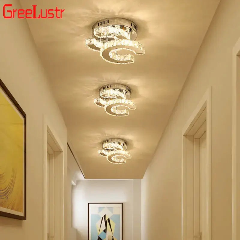 Three sleek modern decorbites crystal led ceiling lamps with crystal rings and chrome base for living room decor