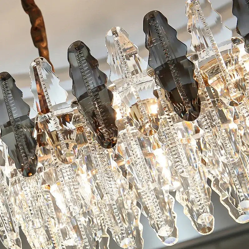 Modern crystal led chandeliers with clear and dark gray crystal droplets on a bronze frame for dining room decorbites crystal led