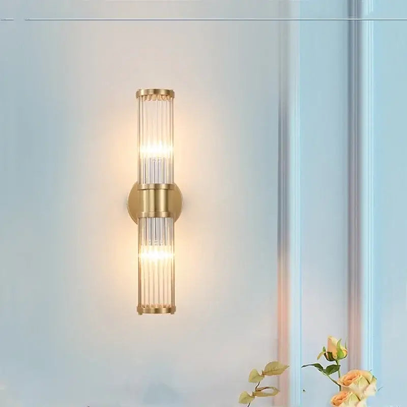 Modern crystal led gold wall sconce with vertical glass rods and warm glowing light for elegant decorbites crystal led decor