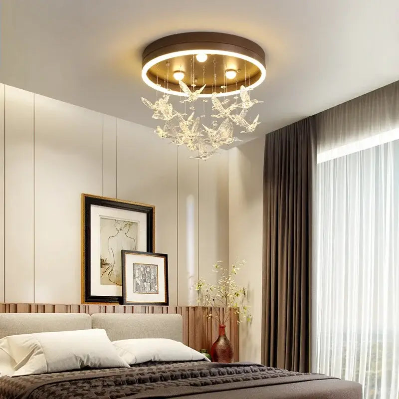 Modern crystal led hummingbird chandelier bedroom ceiling light with warm gold frame and dangling crystal butterfly ornaments