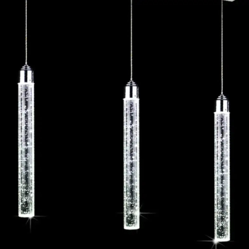 Three sleek crystal led pendant lights with chrome accents hang against black background modern decorbites crystal led