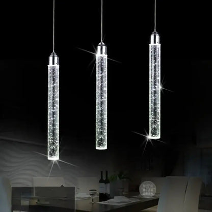 Three sleek cylindrical crystal led pendant lights with chrome tops for modern dining room decorbites crystal led lighting