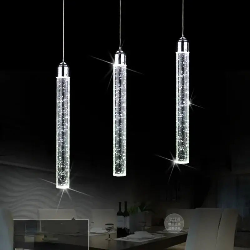 Three sleek cylindrical crystal led pendant lights with chrome tops for modern dining room decorbites crystal led lighting