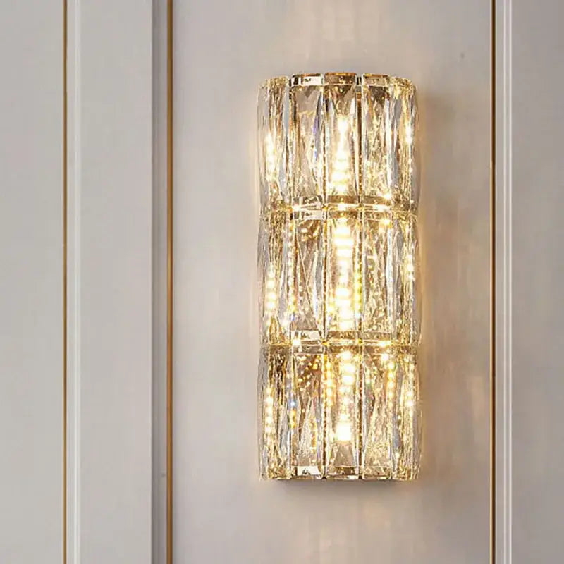 Modern crystal led wall lamp with stacked faceted crystal segments and warm integrated led lighting for living room decorbites crystal led