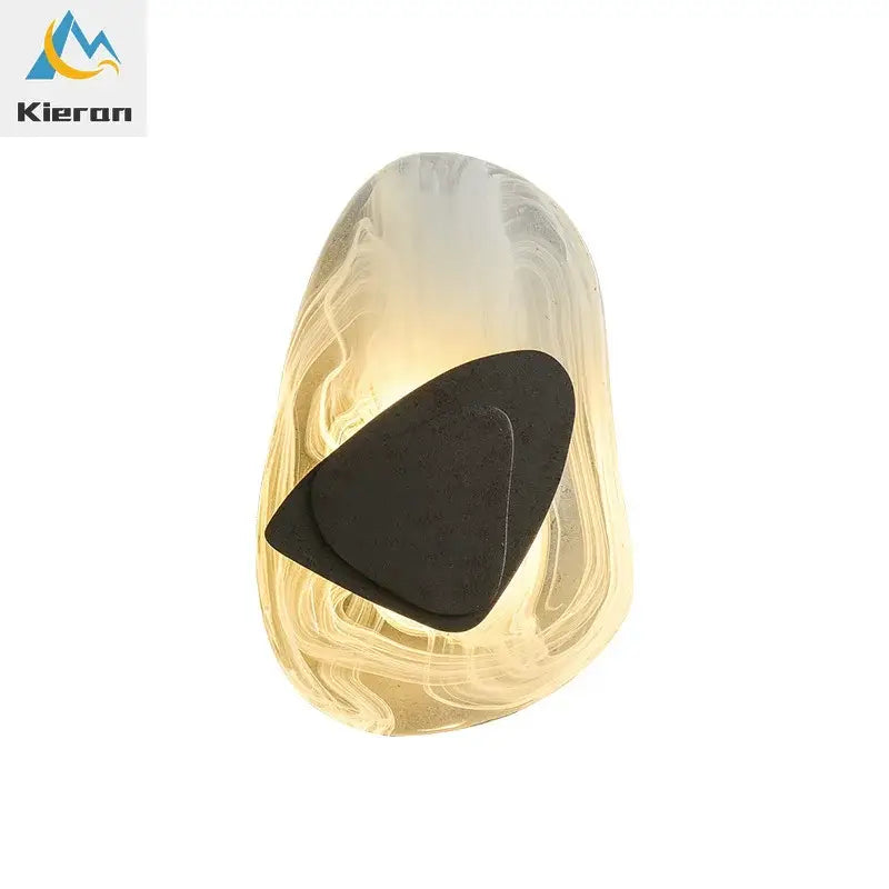 Modern crystal led wall lamp with bronze accent featuring a translucent amber glass guitar pick holder and black insert