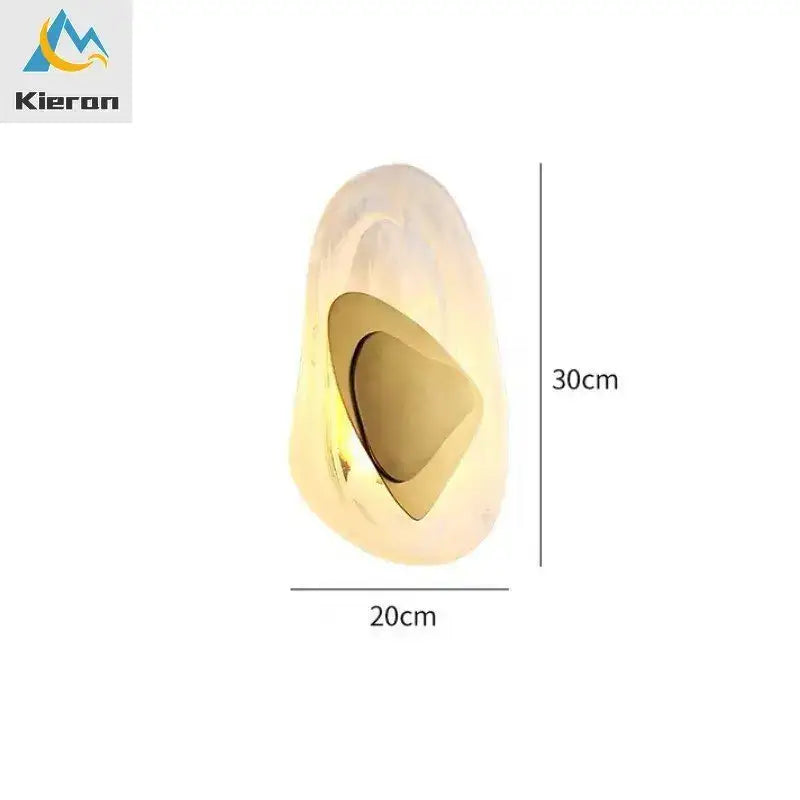 Modern crystal led wall lamp with bronze accent featuring a gold-toned glossy resin sculpture and concave cutout decorbites crystal led