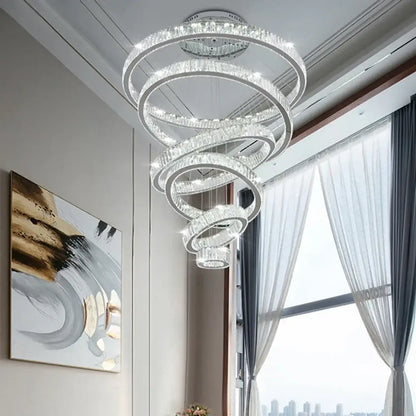 Modern crystal ring led chandelier with clear crystal accents and sleek metallic frame for dining room decorbites decor
