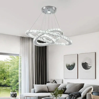 Modern crystal rings led pendant light with interlocking chrome rings and clear crystals for elegant dining room decorbites chandelier