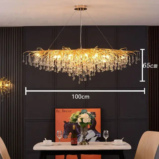 Modern crystal teardrop gold chandelier with golden branch design and dangling crystal droplets for elegant living room decorbites
