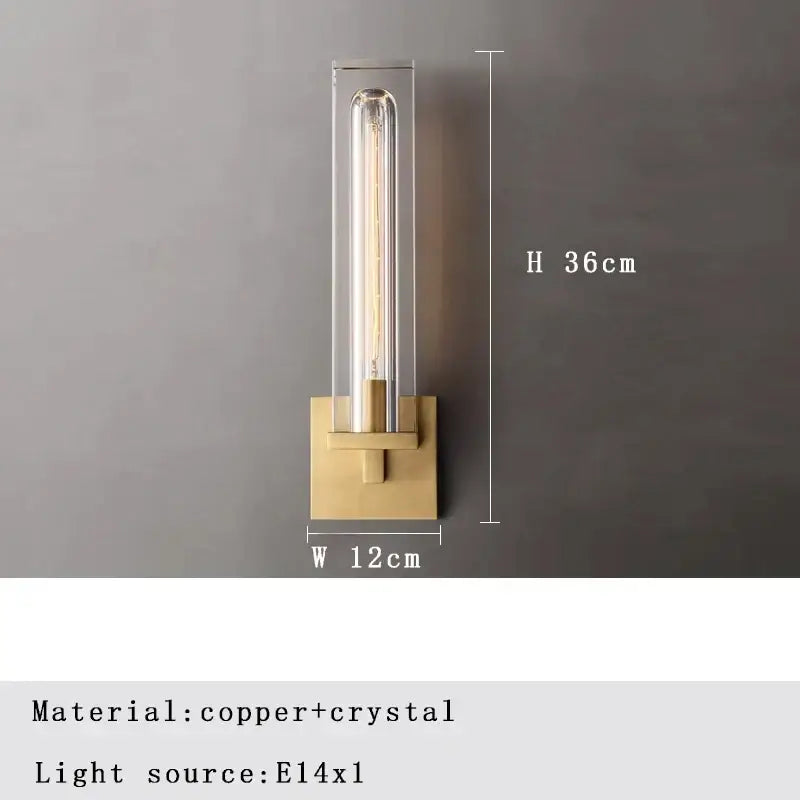 A modern crystal wall lamp with brass base, clear crystal housing, and exposed edison bulb for elegant wall lamp decorbites lighting