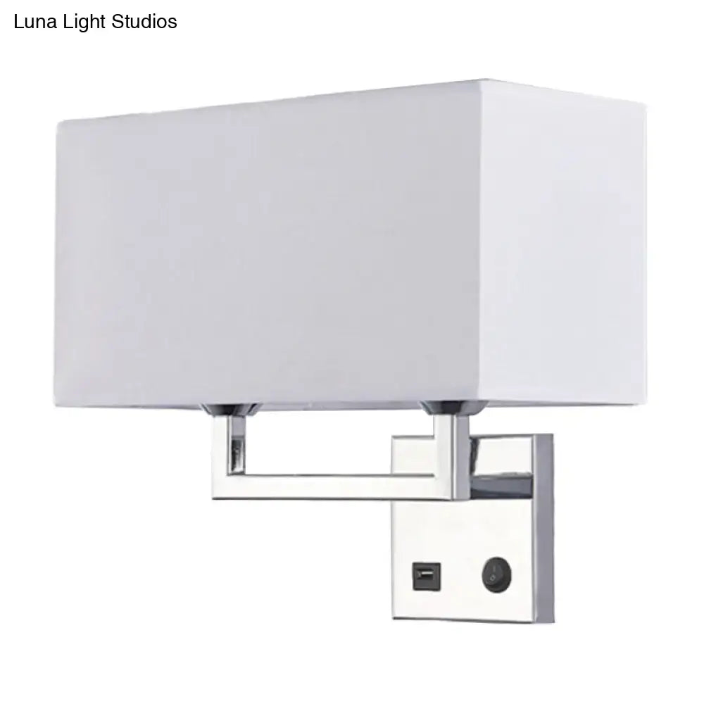 Modern cuboidal fabric wall light with beige white fabric shade chrome frame and integrated usb port and switch mounting plate