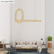A modern gold-toned key-shaped cut crystal ceiling light pendant with textured surface for 220v-240v kitchen island