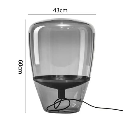 A sleek translucent gray glass table lamp with black base and cord by decorbites glass table for bedroom led lighting