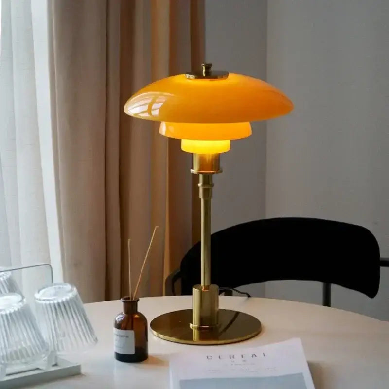 Modern danish amber and frosted glass desk lamp with warm yellow-orange glass and brass base for bedroom decorbites glass desk