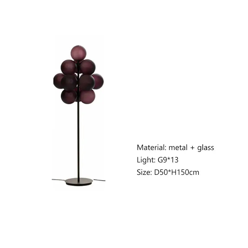 A modern dark brown floor lamp with slender black metal stand and deep purple glass spheres by decorbites bubbleglass led