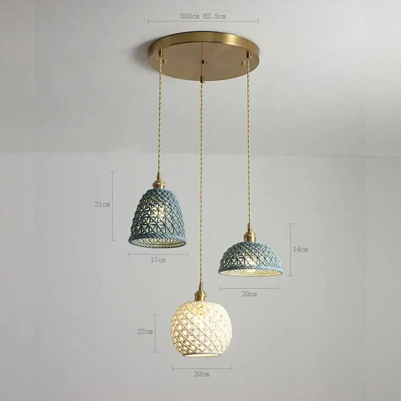 Set of three modern dark gray ceramic led pendant lamps with brass fixtures and woven glass shades in teal cream and white
