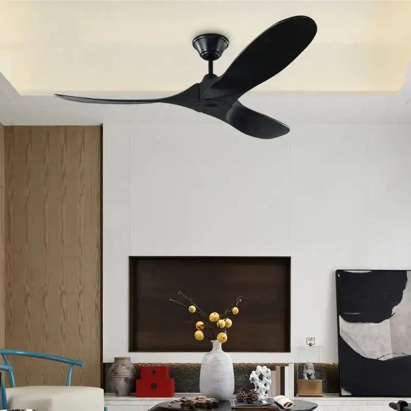 Black three-blade ceiling fan with large wood blade design and remote control for modern living room use
