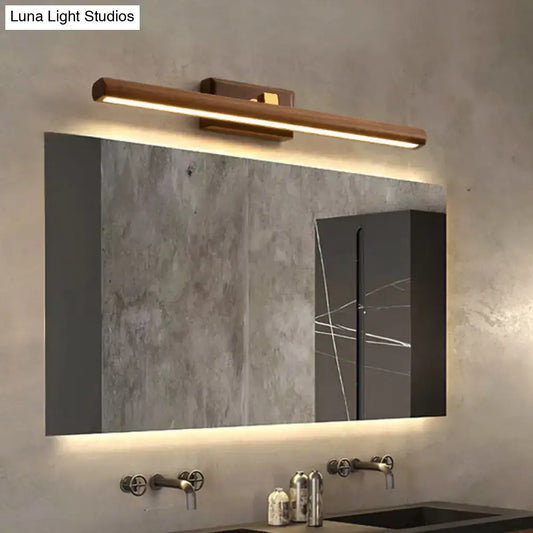 Modern dark wood linear wall sconce bathroom vanity light with sleek minimalist design and warm led illumination