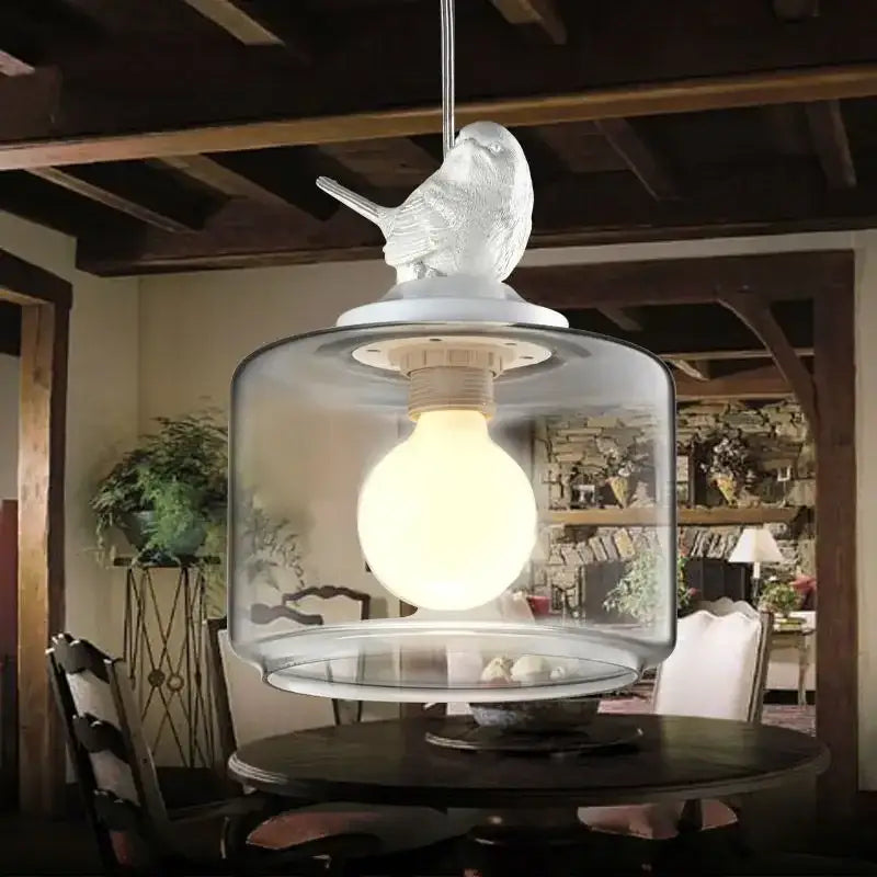 Modern decorbites bird led glass chandelier with a translucent bird on a clear lampshade for dining room lighting