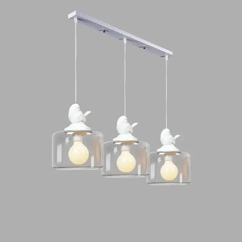 Modern decorbites bird led chandelier with white bird-themed frame and three clear glass shades for dining room lighting