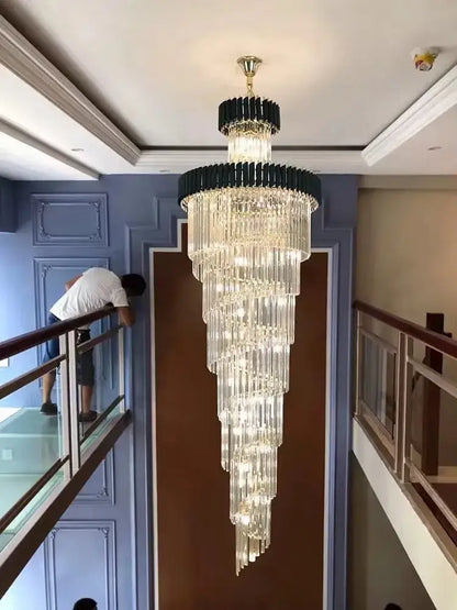 A modern decorbites crystal black clear led chandelier with cascading crystal rods and black metal frame for staircase