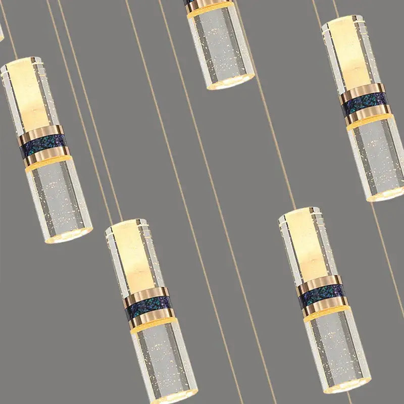 Modern decorbites crystal columnar chandelier with gold-toned metal and clear glass for stairway lighting