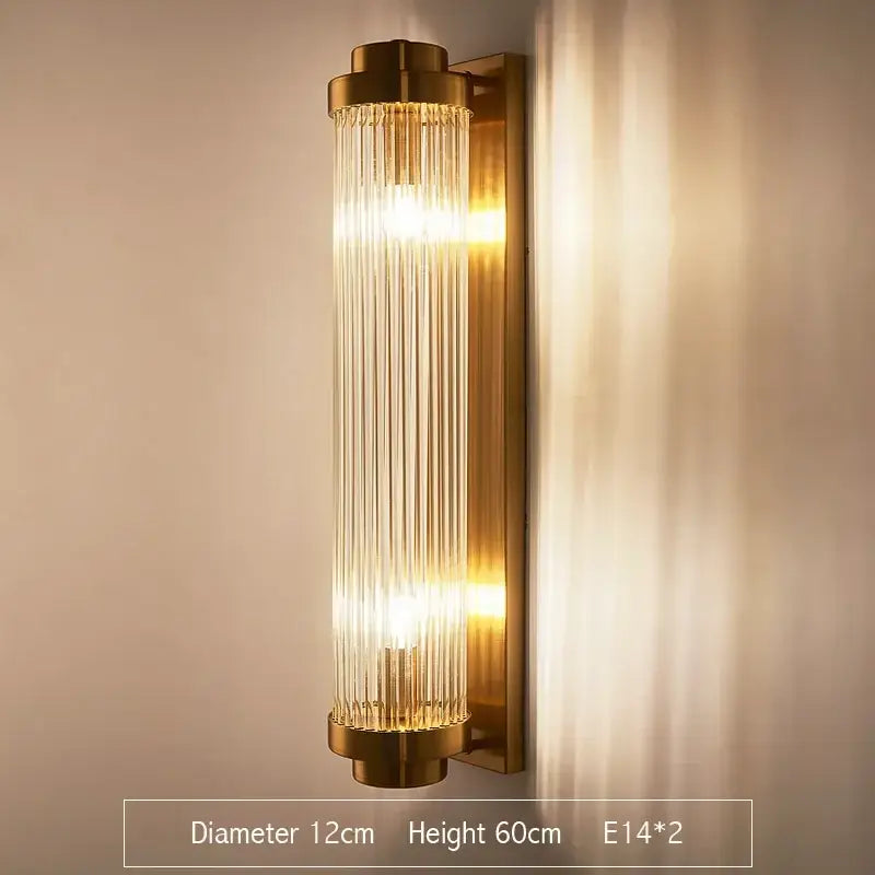 Gold finished decorbites crystal gold led wall sconce with vertical glass rods emitting warm glow for bedroom light