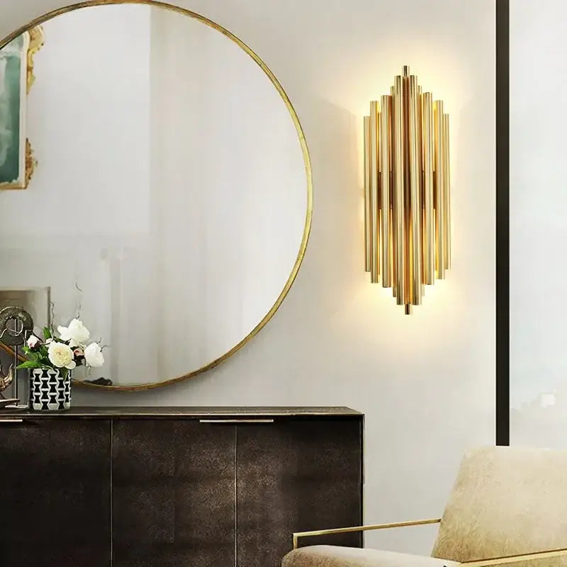 Modern decorbites crystal gold led wall sconce with vertical brass tubes in radiant geometric pattern for bedroom lighting